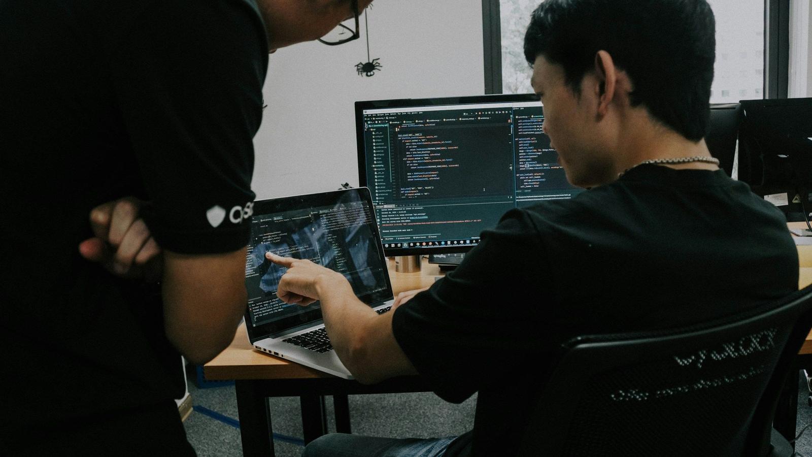 Boy Pointing at Code - Machine Learning Orchestration